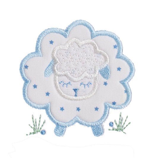 close up of a hand made blue star sheep applique featuring a small blue star fabric print and a design with sweet blue ears and feet