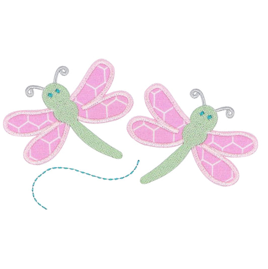 Close-up of two pink and green dragonfly appliques on a white background in an exclusive Deacon Lane design