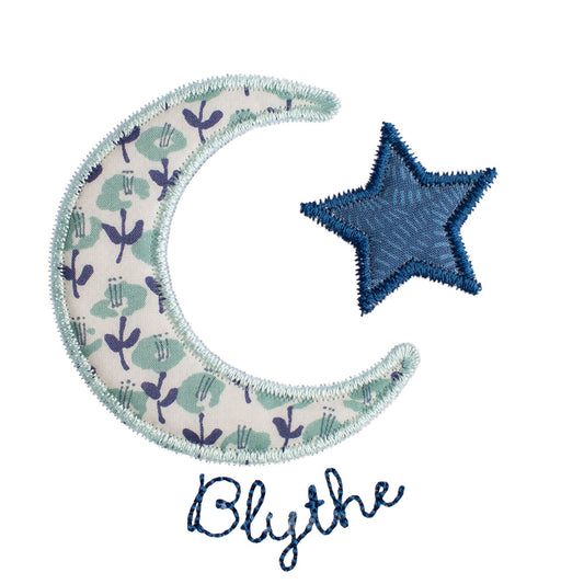 Close up of Deacon Lane's Moon and Star applique with embroidered name wrapping around the moon.