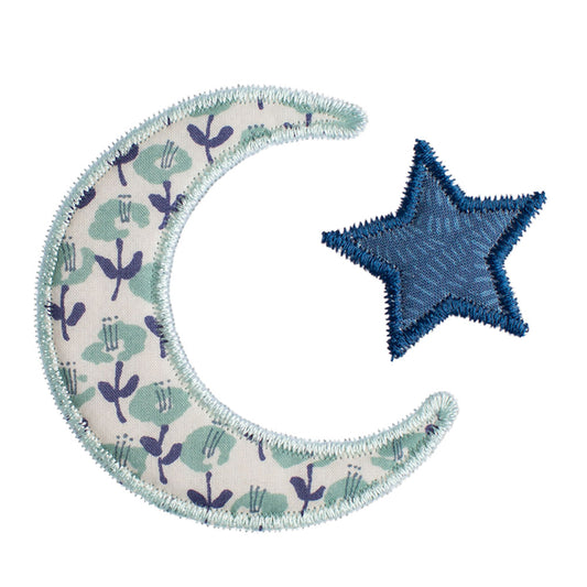 Close-up of Deacon Lane Bella Notte motif in seafoam/sage and navy featuring a floral reminiscent of a Liberty of London print.