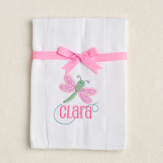 White burp pad with cute appliqued dragonfly with hex pink fabric wings and a green body personalized with a name
