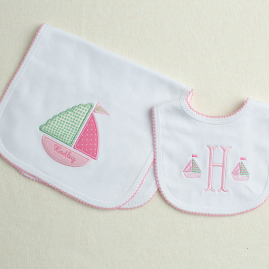 2 piece baby gift set with a nautical theme in shades of pink, green, white and cream.
