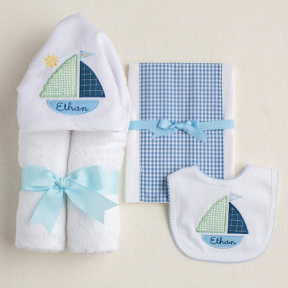 3 piece ultimate gift bundle for the customer wanting a completely personalized gift.  Includes a custom hooded towel and bib along with a fabric burp pad