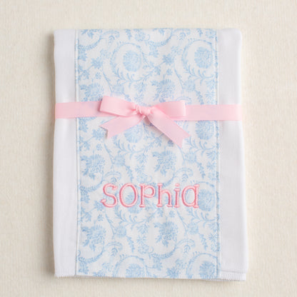 Floral-patterned burp pad personalized with an embroidered name perfect for one of a kind gift giving.