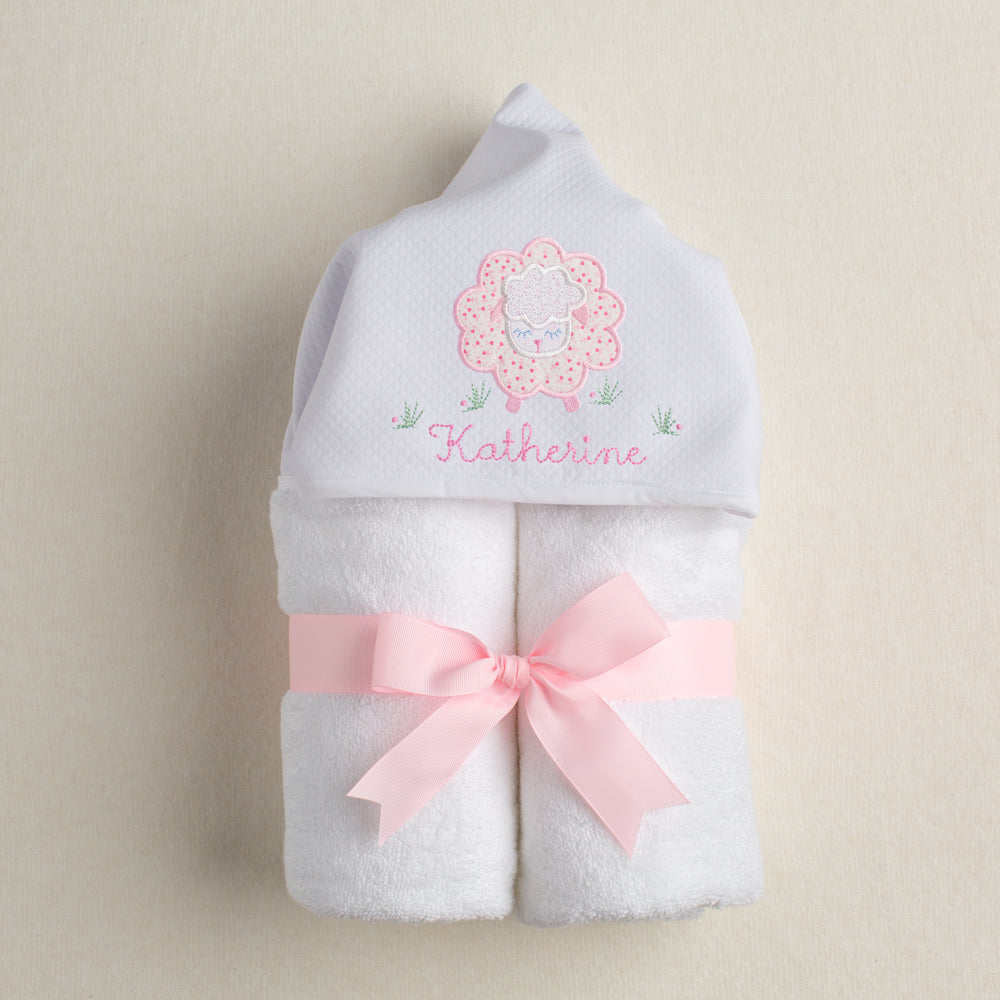 hand made one of a kind hooded towel with an appliqued hood with a pink floral sheep and personalized with an embroidered name