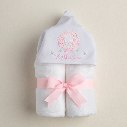 hand made one of a kind hooded towel with an appliqued hood with a pink floral sheep and personalized with an embroidered name