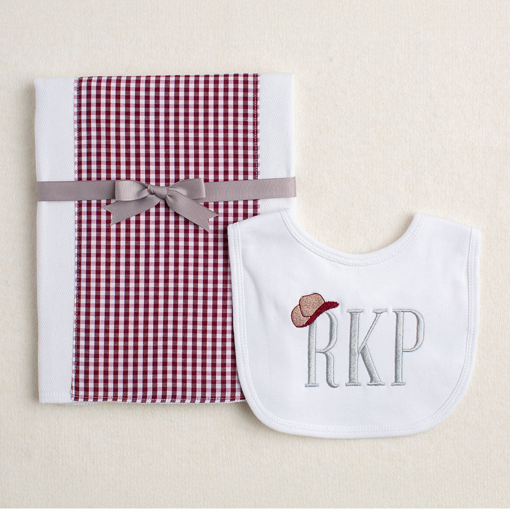 close of up a bib and burp pad set for Aggies
