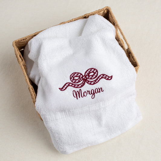 white bath towel with an appliqued maroon bow for the discerning Texas A + M fans