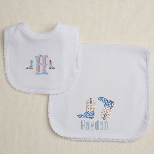 2 piece Western themed gift set with a burp pad with appliqued cowboy boots and a bib with a western shadow two tone font.