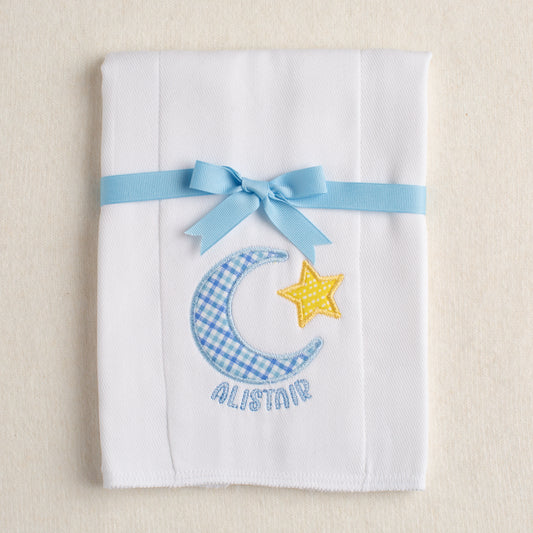 hand appliqued cotton burp pad made from a cloth diaper with a moon and star motif in blue and yellow for boutique, personalized gift giving