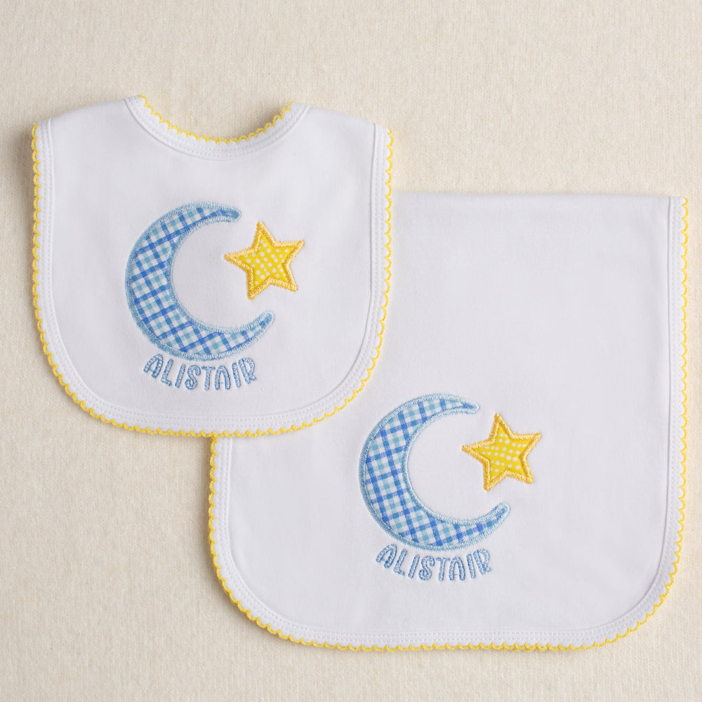 All cotton knit gift set - a burp pad and bib both with picot trim and a hand appliqued moon and star motif with a personalized name.
