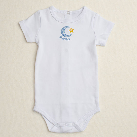 White baby bodysuit/onesie with Deacon Lane's exclusive Bella Notte moon and star applique design.