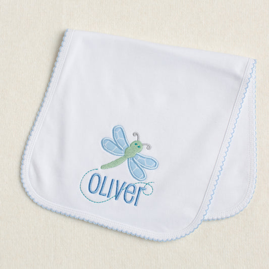 Picot trimmed white burp pad with green and blue dragonfly applique and embroidered name