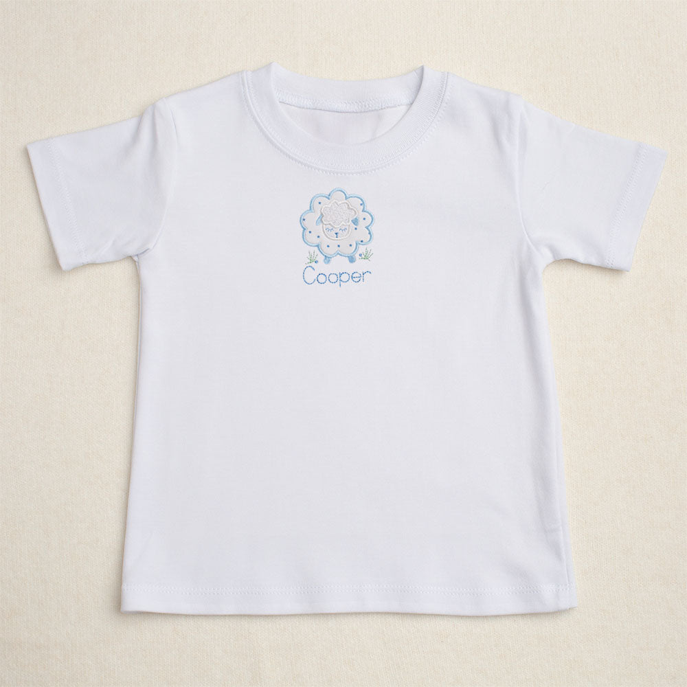 premium cotton t-shirt with hand made appliqued sheep and a personalized embroidered name for a personalized boutique children's gift
