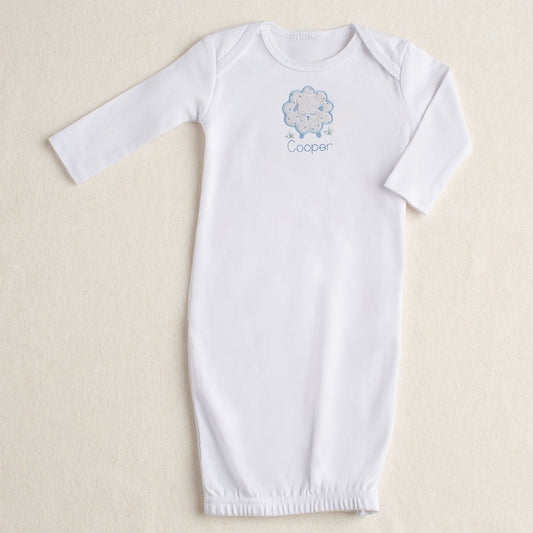 White cotton newborn to 3 months gown with hand made blue star sheep applique with a zippered opening at the bottom