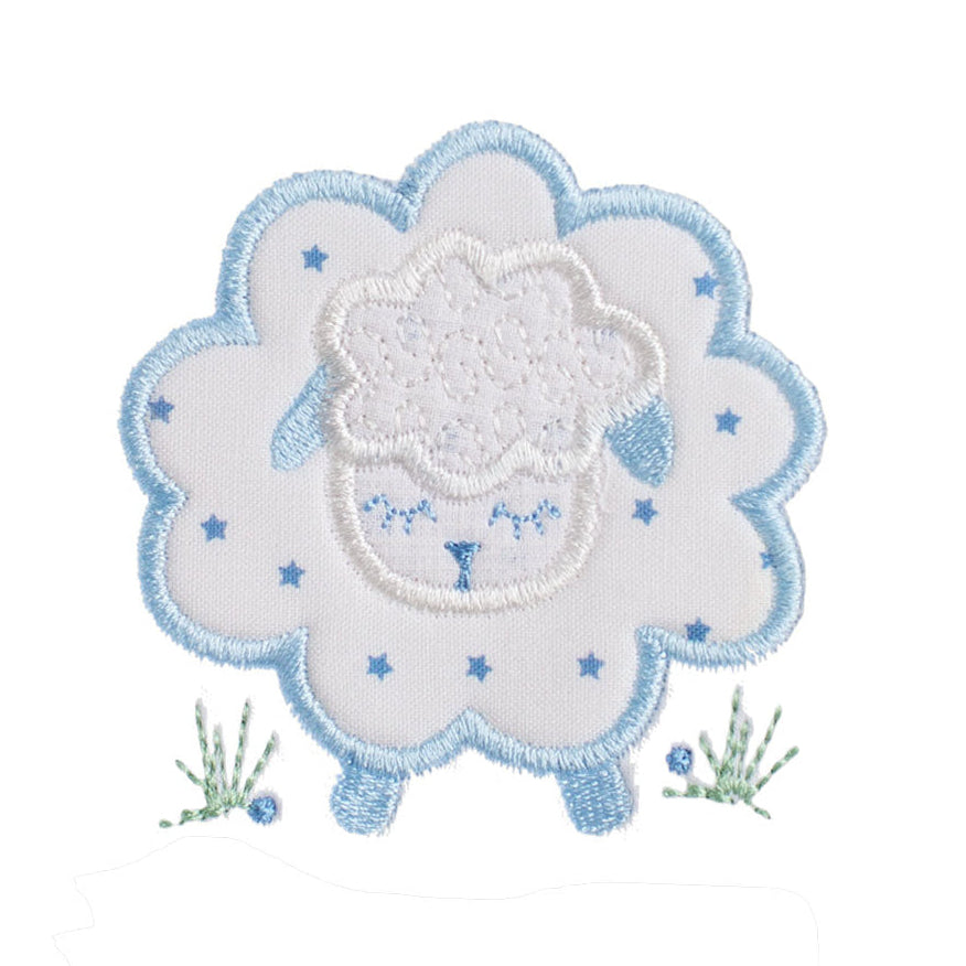 close up of a hand made blue star sheep applique featuring a small blue star fabric print and a design with sweet blue ears and feet