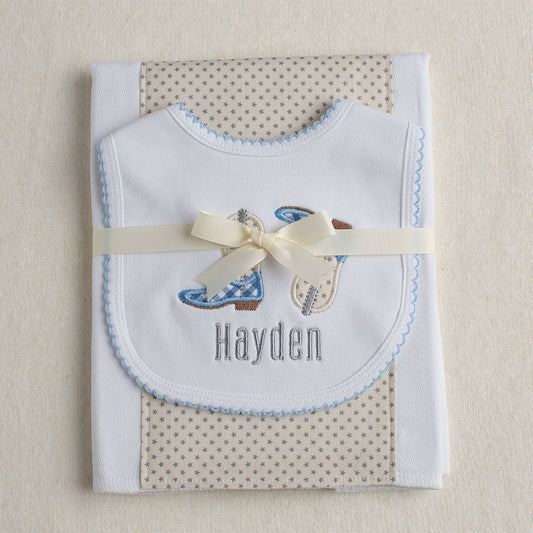 Western inspired baby gift set with a  bib and burp cloth set with appliqued cowboy boots in a Deacon Lane exclusive design
