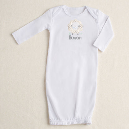 White NB-3M gown with a zippered bottom opening.  Featuring Deacon Lane's gender neutral Grey Fluffy Sheep applique in cream, white, and grey.