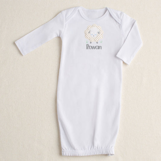 White NB-3M gown with a zippered bottom opening.  Featuring Deacon Lane's gender neutral Grey Fluffy Sheep applique in cream, white, and grey.