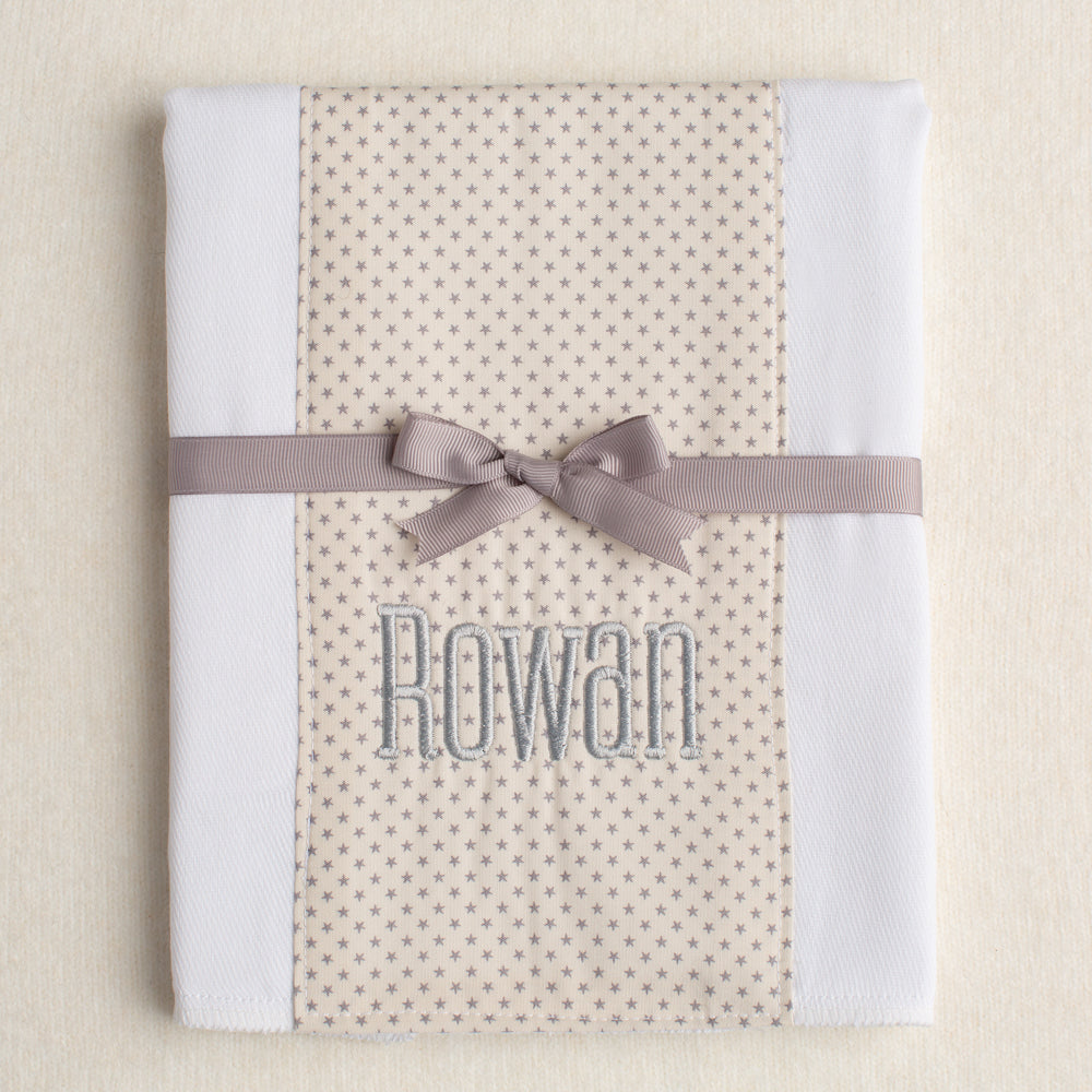 white all cotton burp pad made from a cloth diaper with a personalized name embroidery ready for gift giving tied with a grosgrain ribbon
