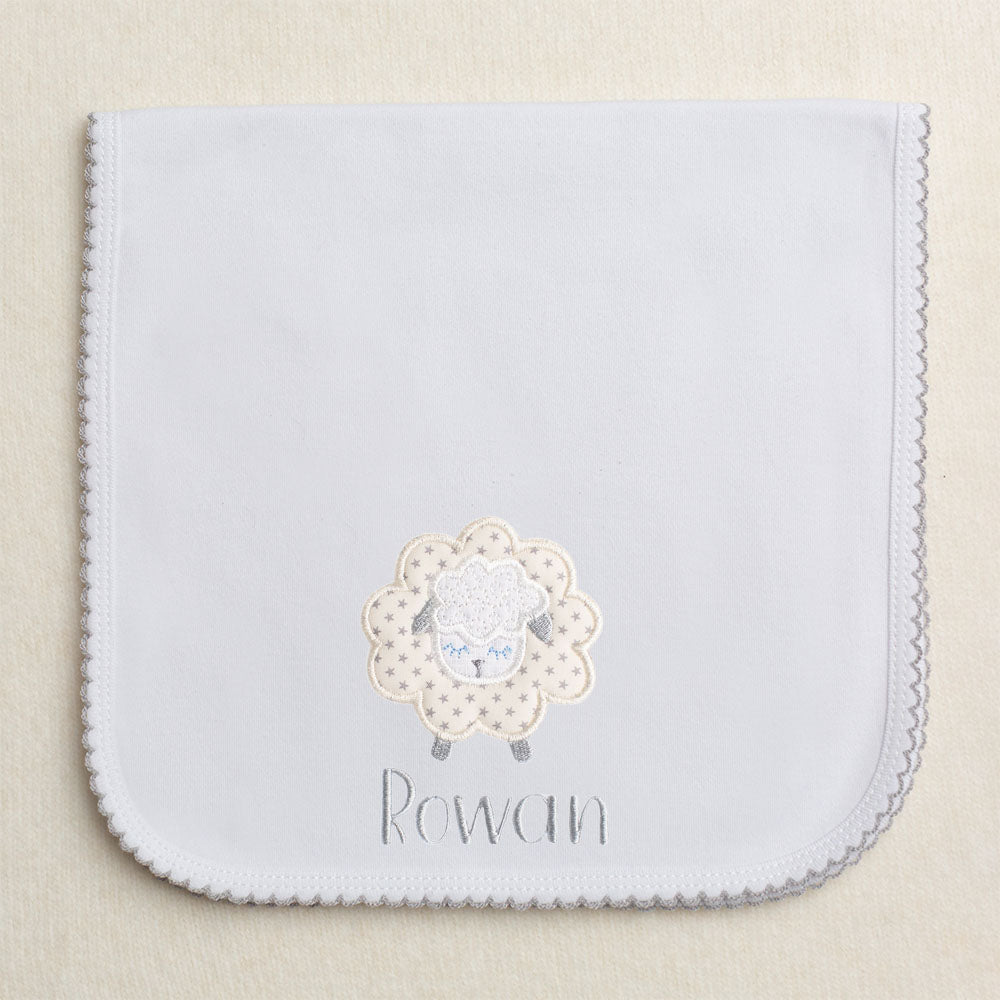 Grey picot trimmed gender neutral burp pad with fluffy grey star applique sheep with embroidered name