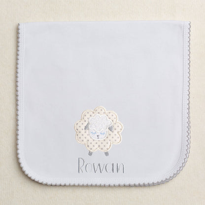 Grey picot trimmed gender neutral burp pad with fluffy grey star applique sheep with embroidered name