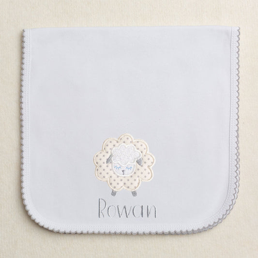 Grey picot trimmed gender neutral burp pad with fluffy grey star applique sheep with embroidered name
