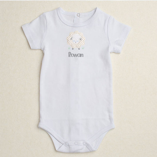 White bodysuit/onesie featuring Deacon Lane's Grey Fluffy Sheep applique in grey, cream, and white.