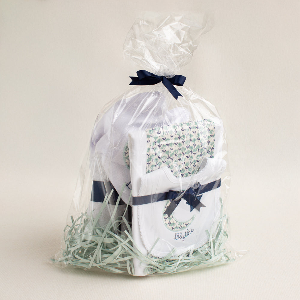 Beautifully packaged boutique baby gift set with appliqued moon and stars applique in a navy and seafoam print fabric