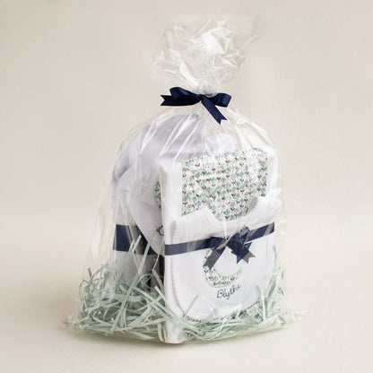 Beautifully packaged boutique baby gift set with appliqued moon and stars applique in a navy and seafoam print fabric