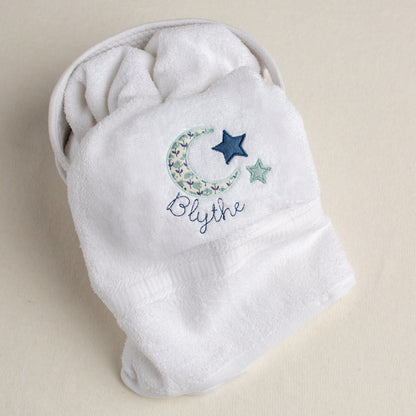 white cotton bath towel personalized for your child with a lovely moon and star motif in seafoam and navy with a custom name embroidery.