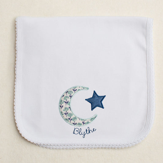 Picot trimmed burp pad with seafoam and navy floral moon and star applique with embroidered name.