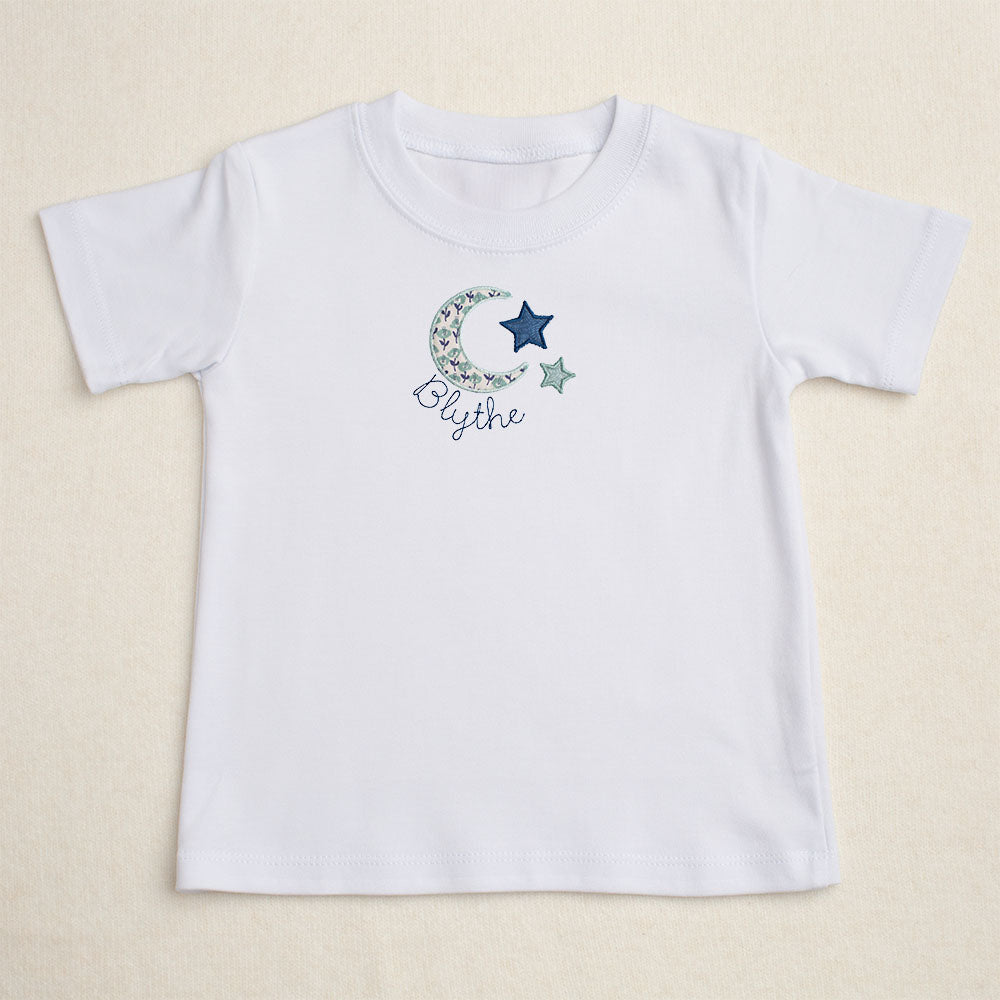 white t-shirt with Deacon Lane's exclusive moon and star applique design from their Bella Notte collection.  Perfect for big sister to match younger siblings with a handmade gift.