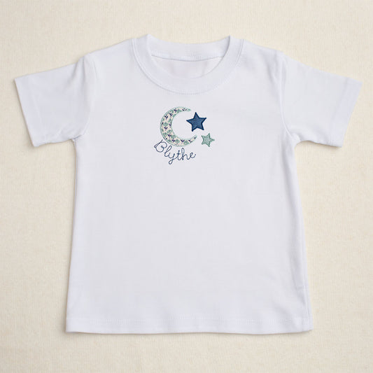 white t-shirt with Deacon Lane's exclusive moon and star applique design from their Bella Notte collection.  Perfect for big sister to match younger siblings with a handmade gift.