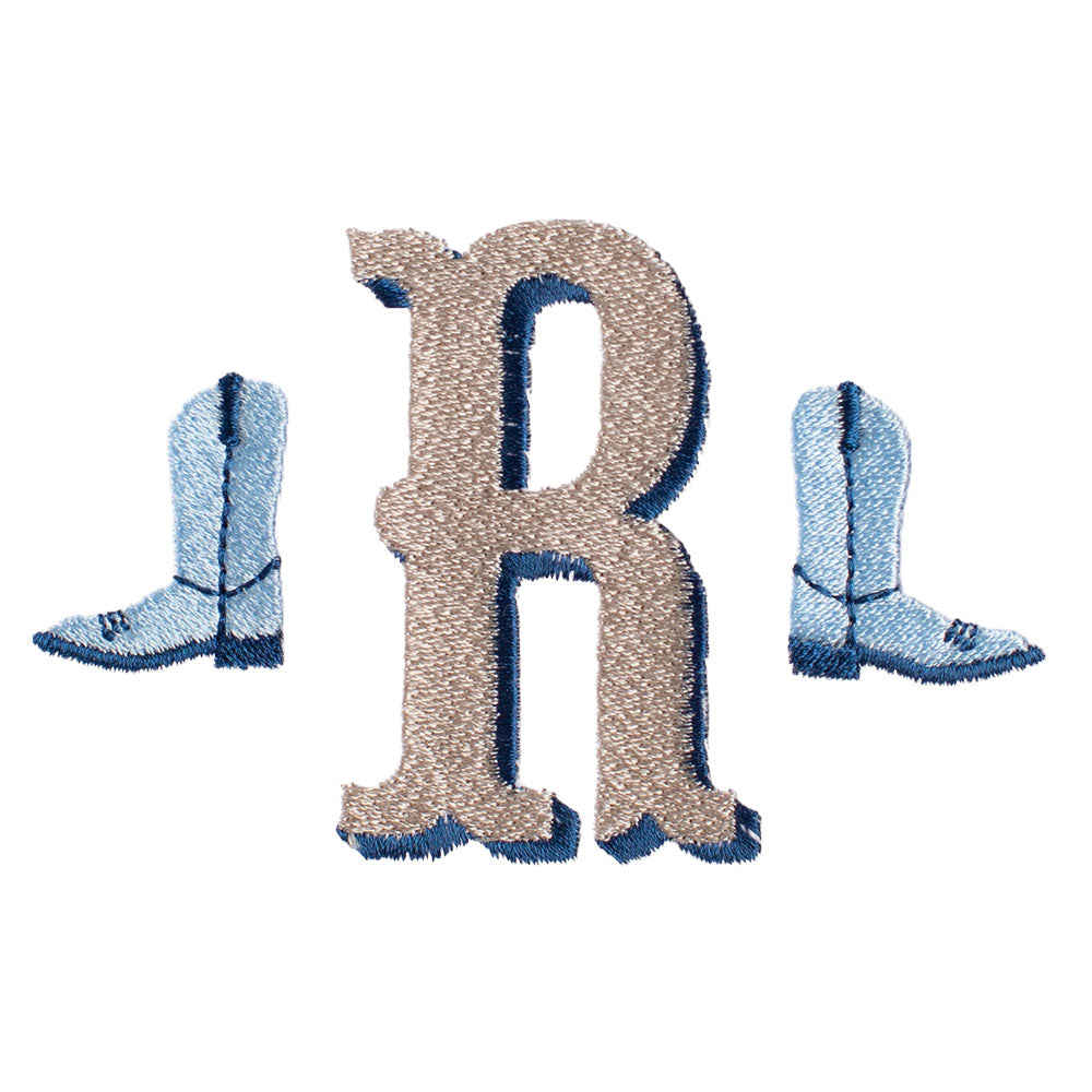 Close up of Deacon Lane's western monogram with cowboy boots embroidered on the side