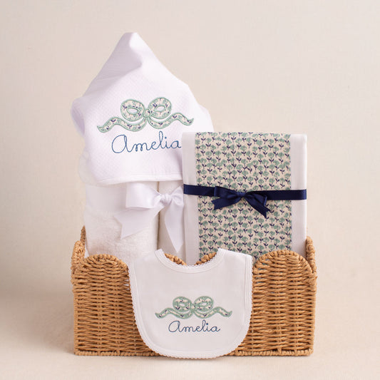 3 piece gift set with Deacon Lane's hooded towel, bib, and fabric burp pad in an applique bow design.