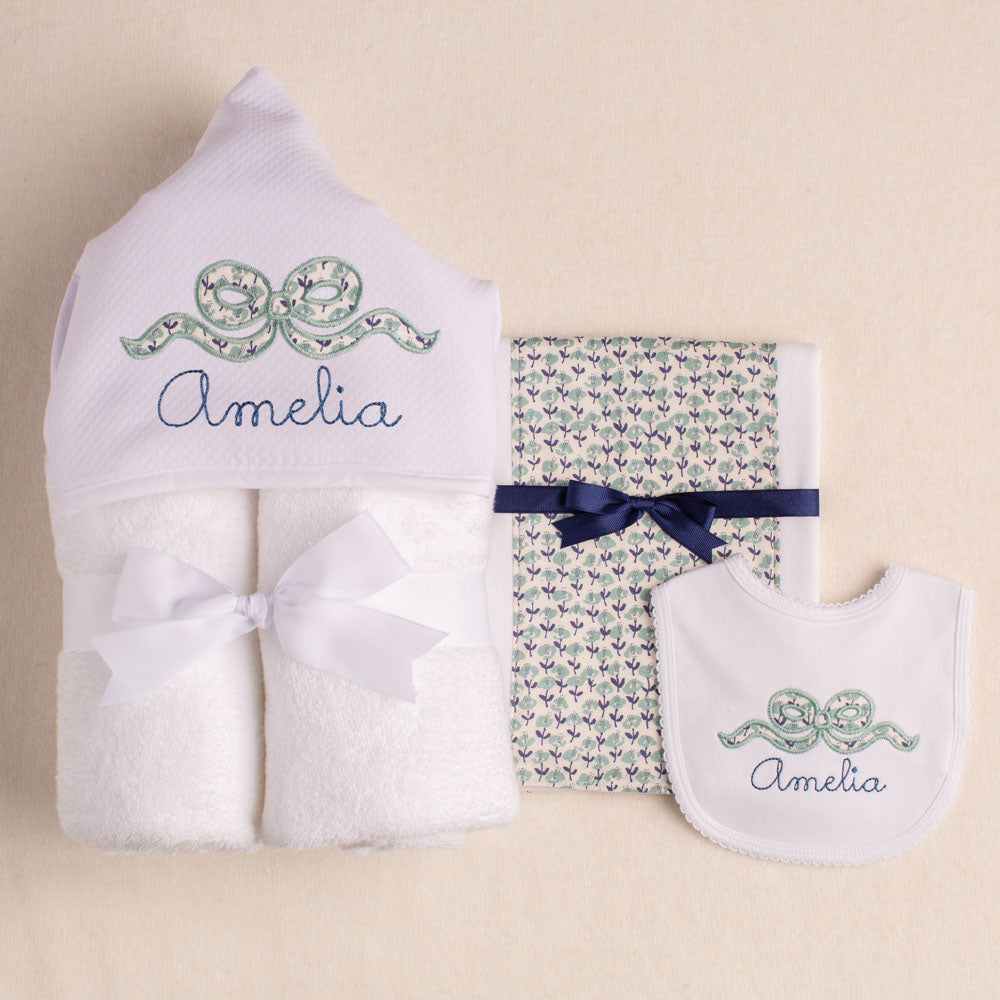 Close up of Deacon Lane's charming bundle in the navy floral applique bow design.