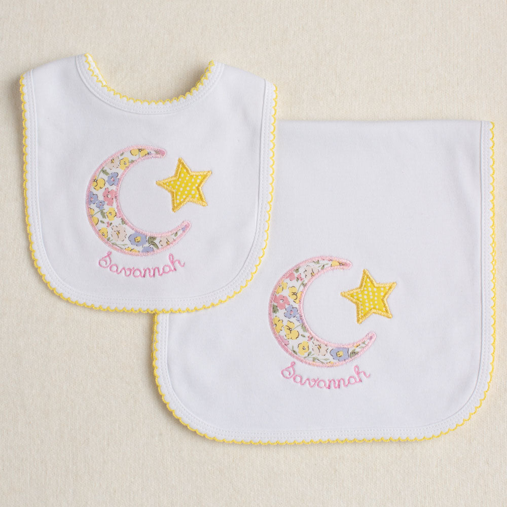 Special gift set including two picot trimmed items - a burp pad and a bib.  Both feature an applique out of a Liberty of London like floral print in a moon and star motif.