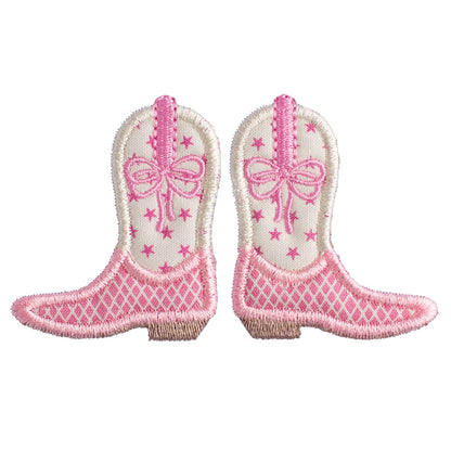 Close up of Deacon Lane's pink cowboy boot applique in shades of pink and cream.