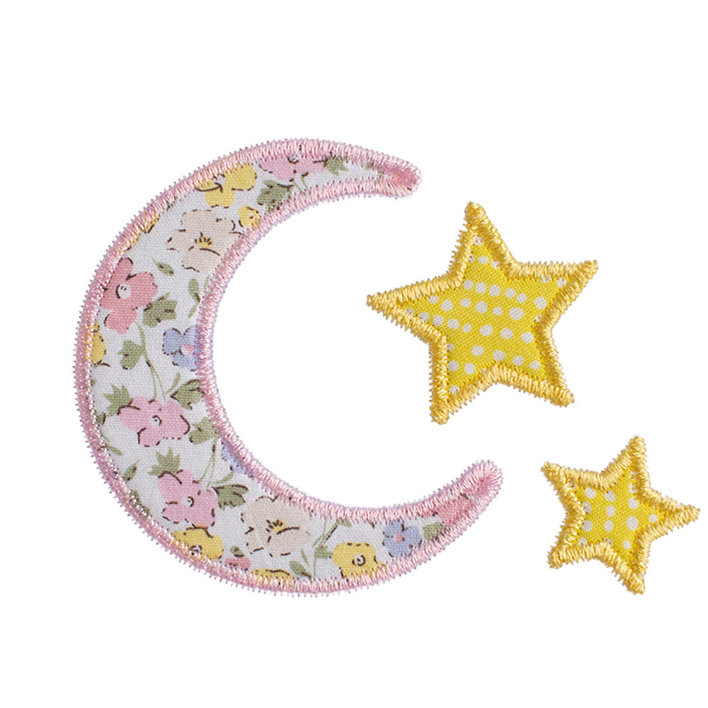 Close up of our moon and star applique that features a beautiful pink floral fabric that is similar in appearance to a Liberty of London print