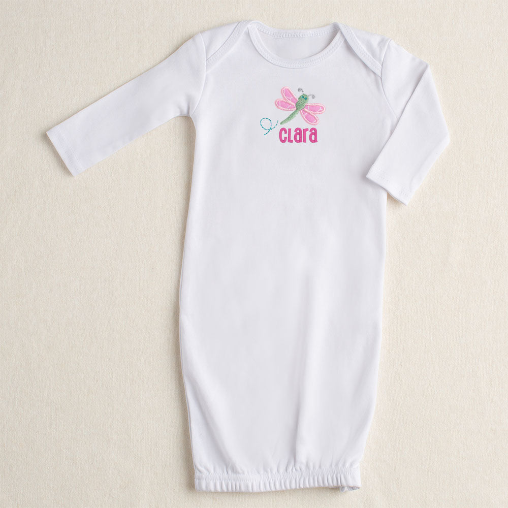 white all cotton baby gown with Deacon Lane's signature pink dragonfly applique in pink and green personalized with a custom name
