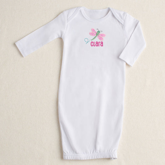 white all cotton baby gown with Deacon Lane's signature pink dragonfly applique in pink and green personalized with a custom name