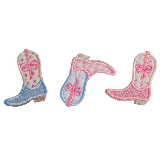 Close up of a fun Cowgirl Chic applique featuring boots in different fabrics in pinks and blues.