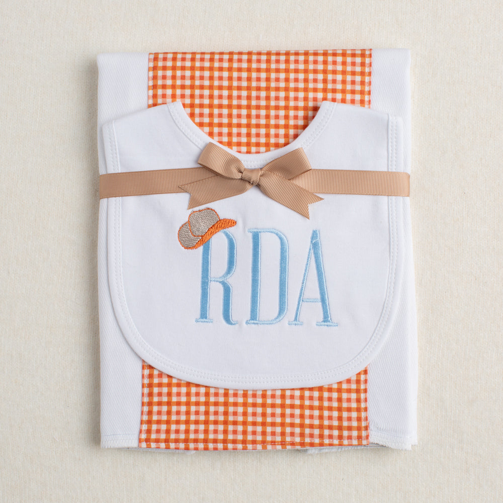 2 piece baby gift set with a monogrammed bib and a fabric burp pad.