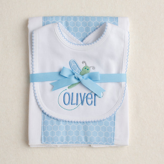 2 piece gift set with a picot bib with a blue applique dragonfly design paired with a fabric burp cloth tied with a grosgrain ribbon.