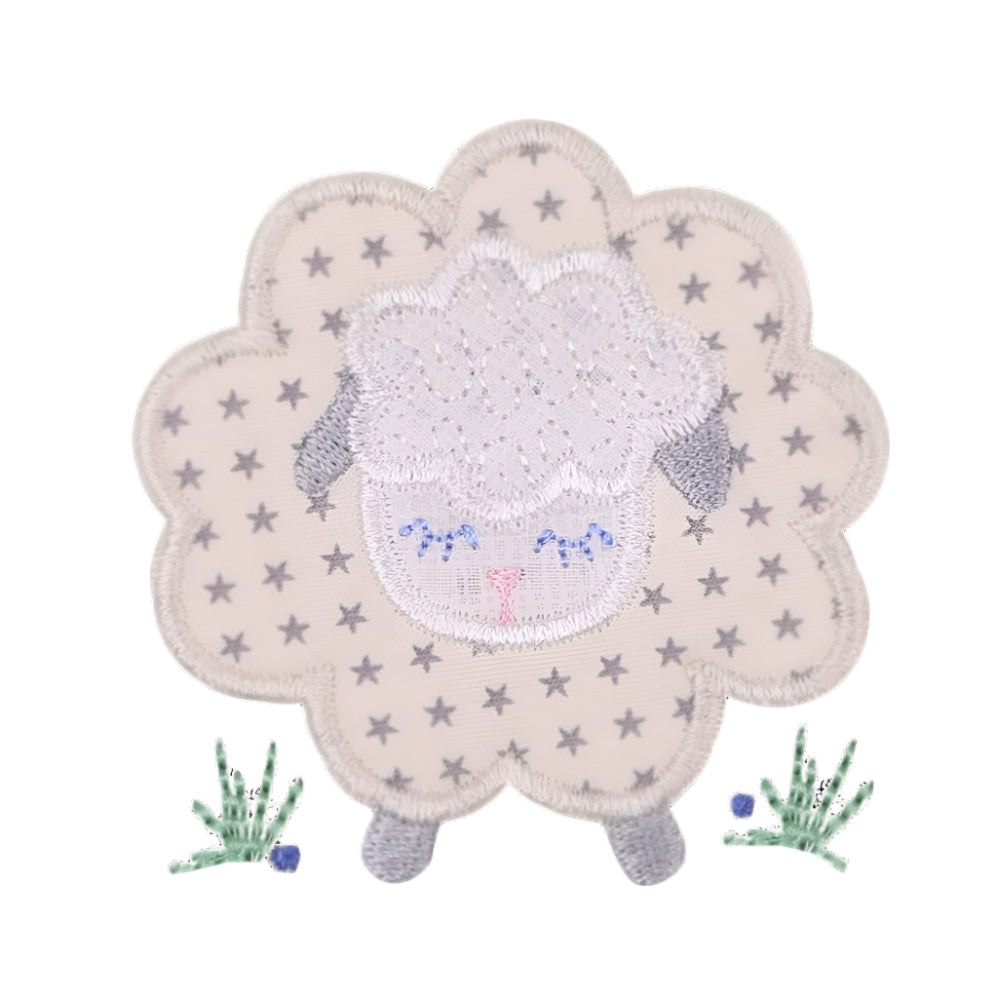 close up of Deacon Lane signature gender neutral grey sheep applique design in grey, cream, and white