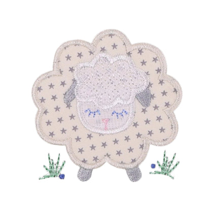 close up picture of Deacon Lane's Fluffy Grey Sheep Applique in shades of cream, grey, and white