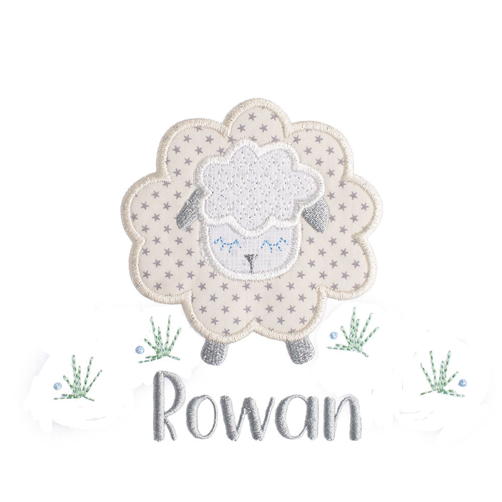 Close up of Deacon Lane's Grey Fluffy Sheep applique in grey, cream, and white