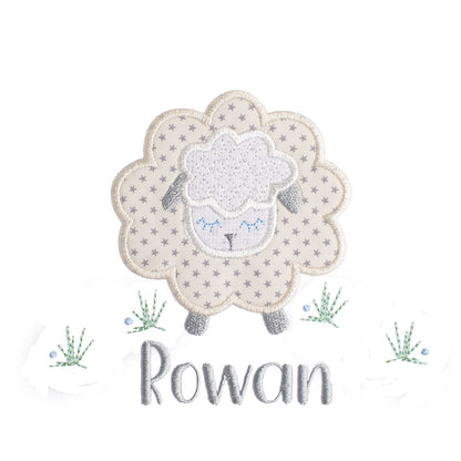 Close up of Deacon Lane's Grey Fluffy Sheep applique in grey, cream, and white