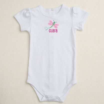 All cotton bodysuit with puff sleeves and a pinkdragonfly applique that can be personalized with embroidery